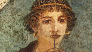 Retrato de una mujer pompeyana “Mujer con tablillas de cera y punzón”. Museo Arqueológico Nacional de Nápoles. Fresco sobre yeso romano, de entre el año 55 y el 79, procedente de Pompeya.